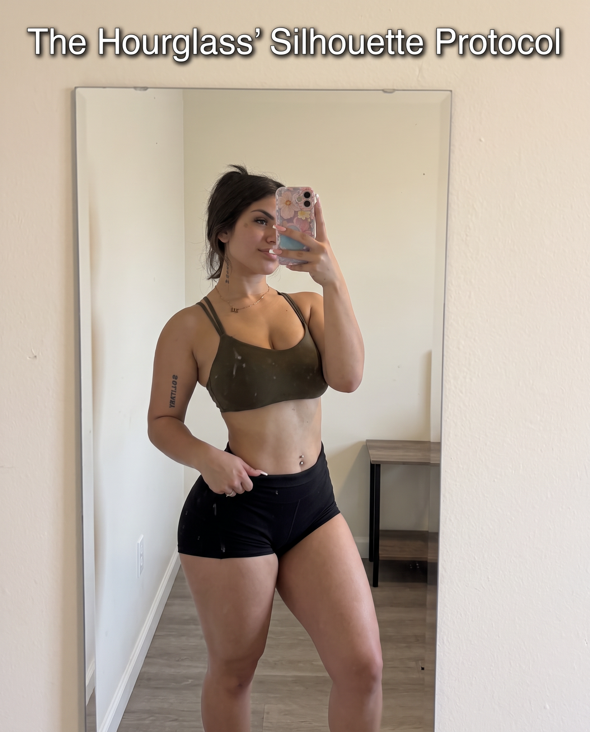 Woman in a brown sports bra and black high-waisted shorts taking a mirror selfie, with 'The Hourglass' Silhouette Protocol' text overlaid at the top